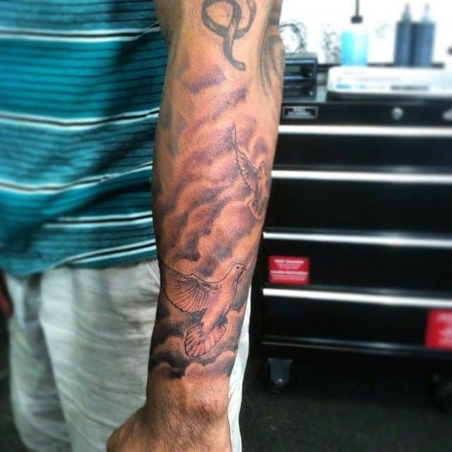 12 Cloud Tattoos On Arm For Men Tattoos Pictures Cloud Tattoo Tattoos For Guys Tattoos