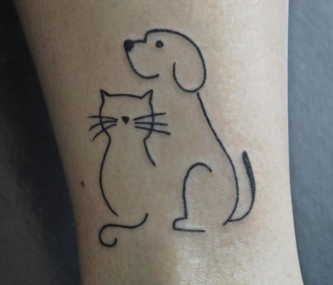 27 Best Cat Dog Tattoo Designs The Paws Cat And Dog Tattoo Dog