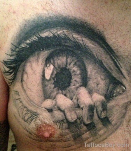 A Man S Chest With An Eye Tattoo On It