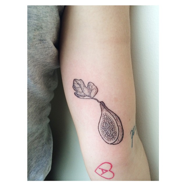 Fig Tattoo Located On The Upper Arm Blackwork Style