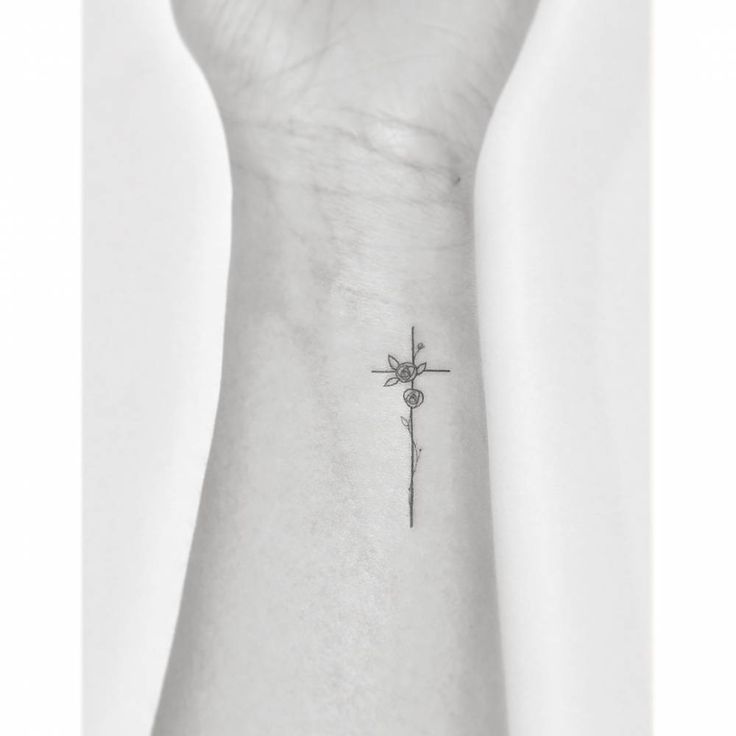 Fine Line Cross With Flowers Tattoo On The Wrist