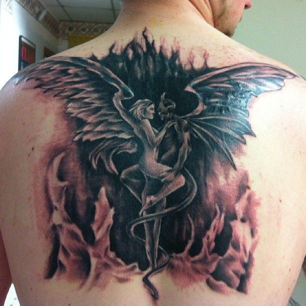 Half Angel Half Devil Tattoo Located On The Shoulder