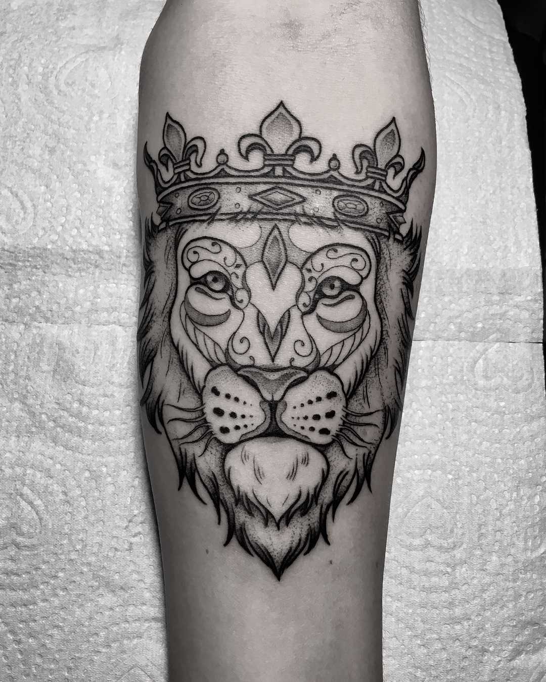 Lion Tattoo On Hand With Crown For Men Who Love Ink