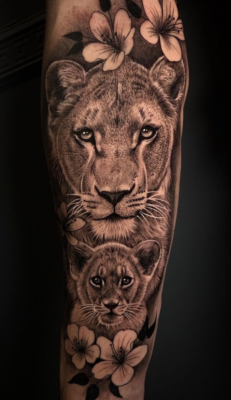 Lioness And Cub Portrait Tattooed On The Upper Arm