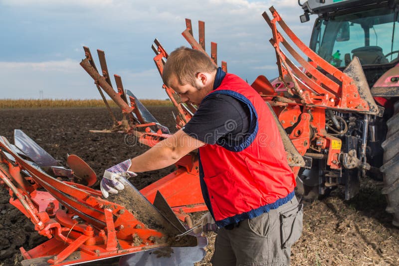 Mechanic Fixing Plow On The Tractor Stock Photo Image Of Wrench Trapped 80664672