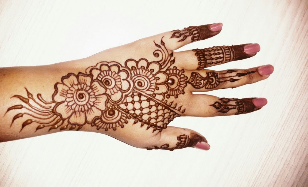 10 Stunning Mehndi Flower Tattoo Designs