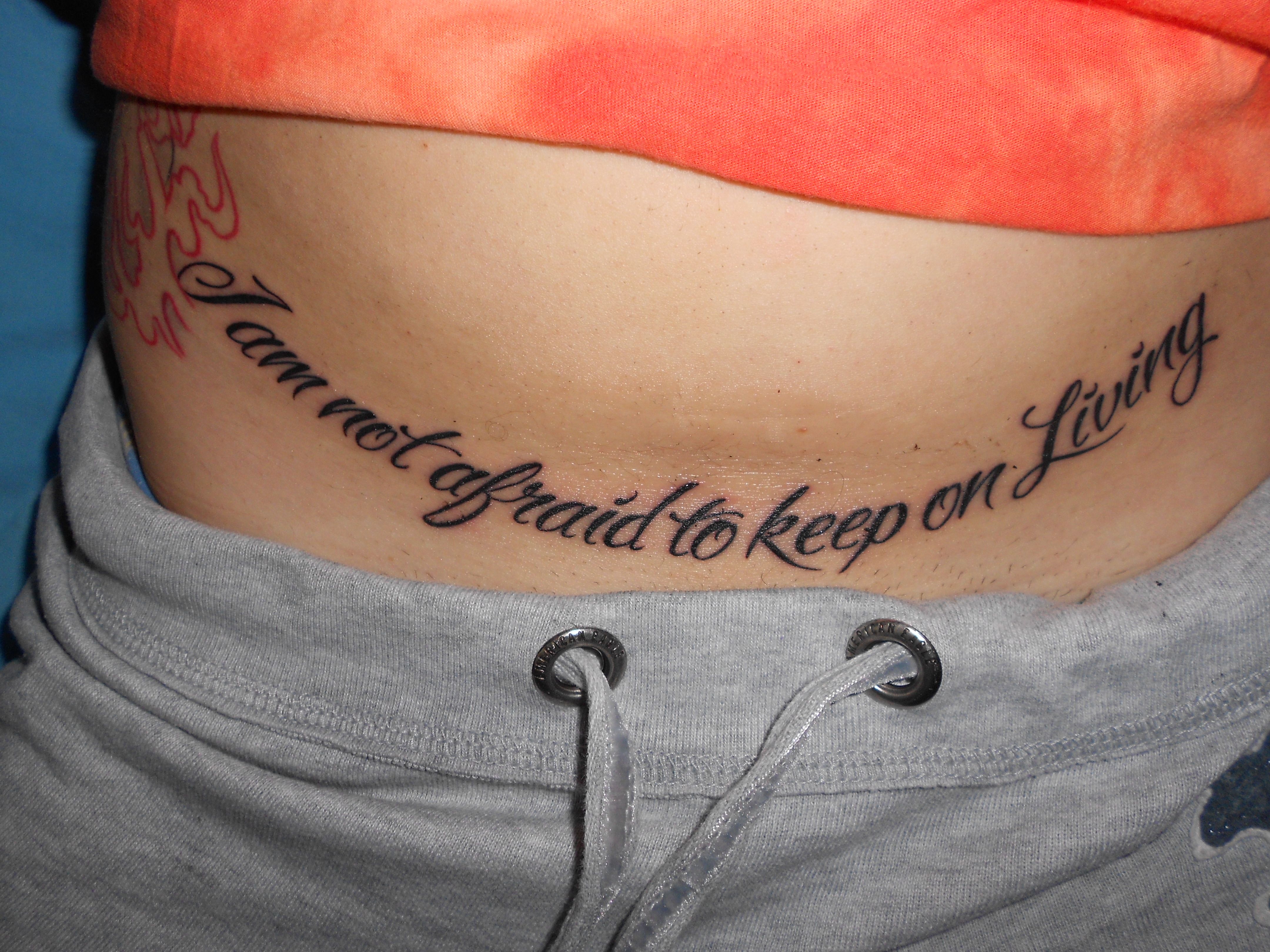 Inspiring Quote Tattoos on Lower Abdomen Designs