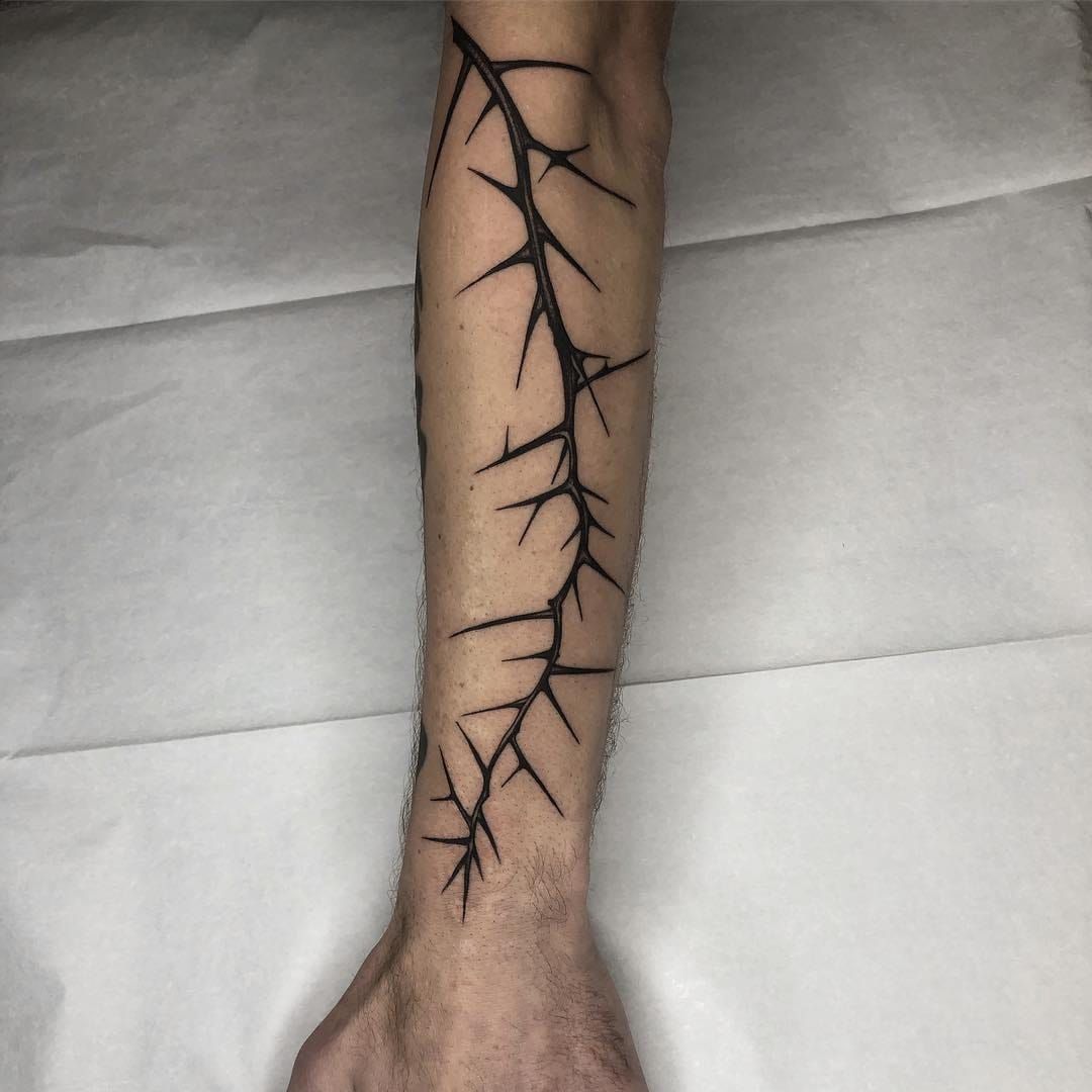 7 Rose Thorn Tattoo Designs You'll Love