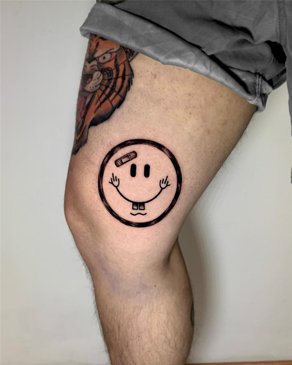 Smiley Face Tattoo Done On The Inner Forearm