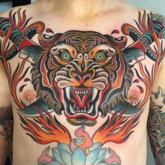 Two Men With Tattoos On Their Back And One Has A Tiger Tattoo On His Chest