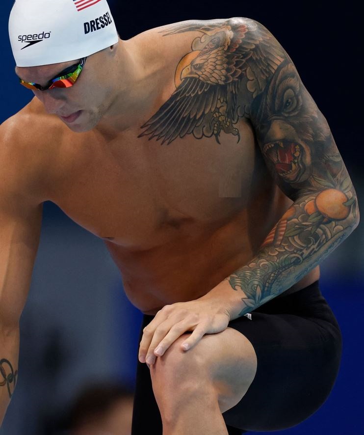 Untold Stories And Meanings Behind Caeleb Dressel S 7 Tattoos Tattoo