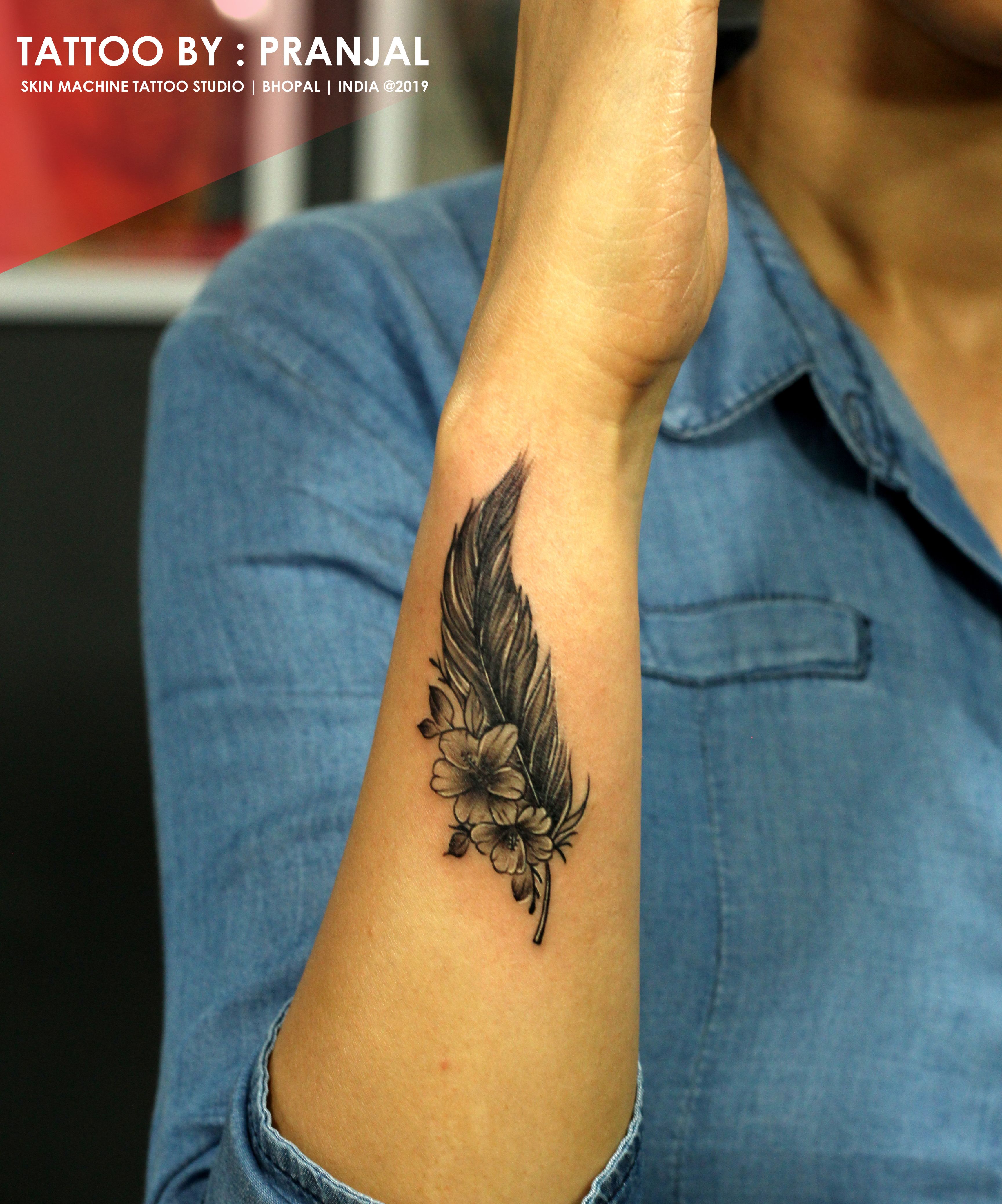 10 Wrist Tattoo Designs for Women with Feathers